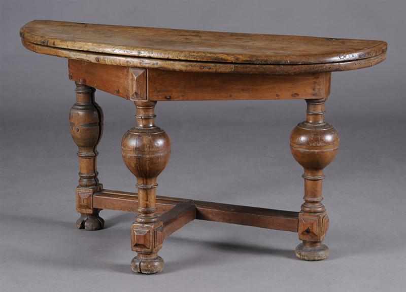 Appraisal: FLEMISH BAROQUE WALNUT FOLD OVER TABLE The D-shaped top above