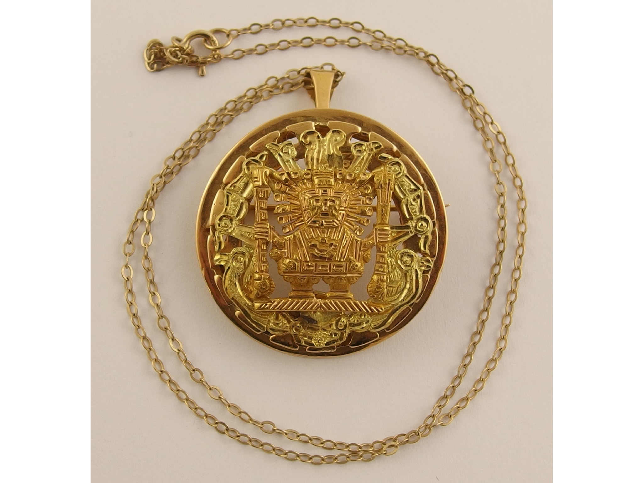 Appraisal: An ct gold Aztec design pendant brooch with a ct