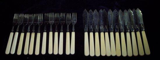 Appraisal: Twelve pairs of fish knives and forks with ivory handles