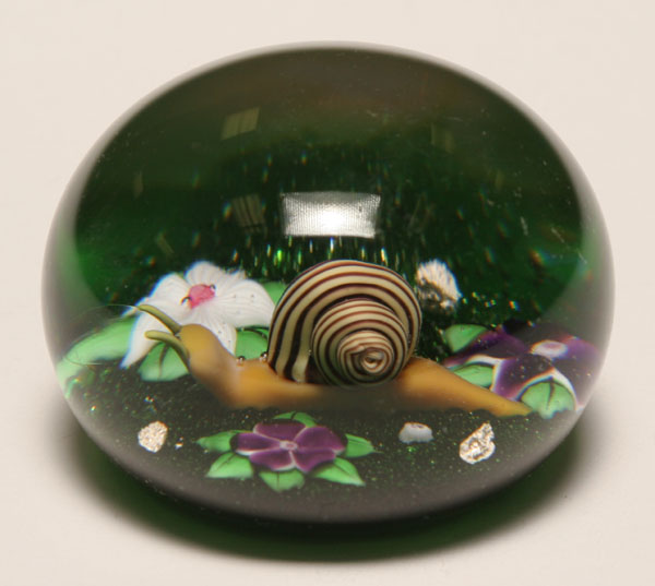 Appraisal: Baccarat French domed glass paperweight internally decorated with a snail