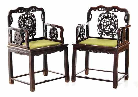 Appraisal: Pair Chinese carved hardwood armchairs circa waved crest and pierced