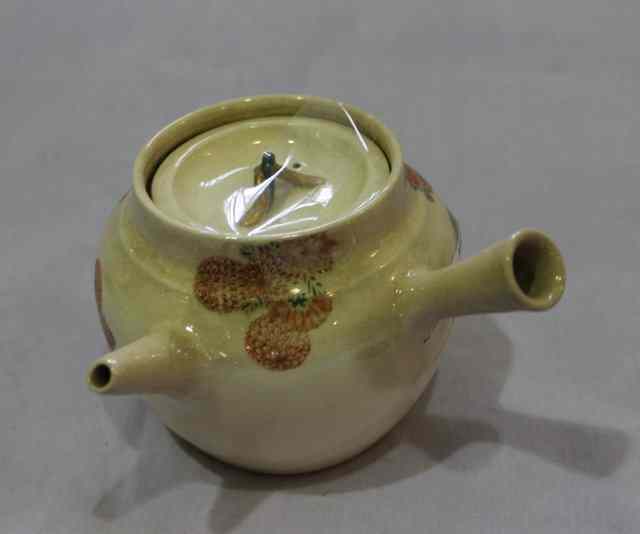 Appraisal: A KYOTO SATSUMA TEAPOT in Banko style painted bamboo canes