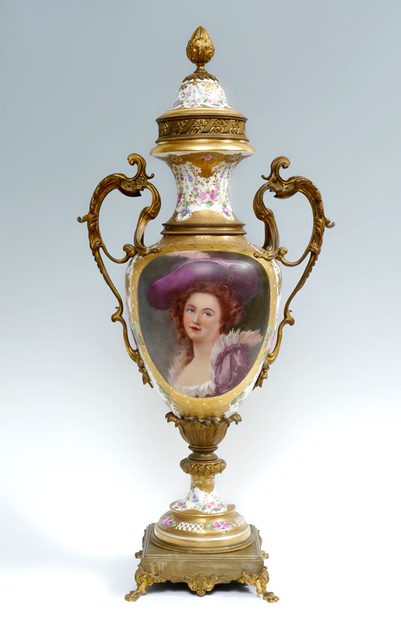 Appraisal: MONUMENTAL SERVES PORTRAIT URN Gilt mounted bronze on porcelain Parcel