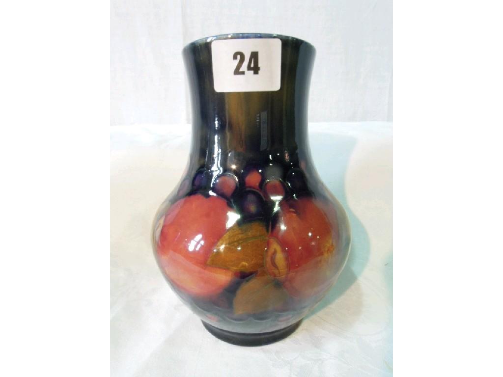 Appraisal: A Moorcroft vase with painted pomegranate decoration and impressed marks