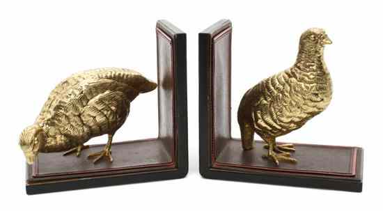 Appraisal: A Pair of Gilt Metal and Leather Book Ends depicting