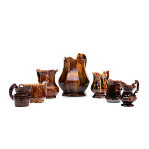 Appraisal: Seven Rockingham Glaze Pitchers th Century including a flint enamel