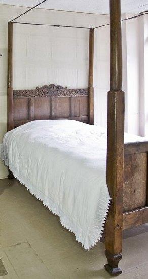 Appraisal: An oak four-poster bed th Century and later the panelled