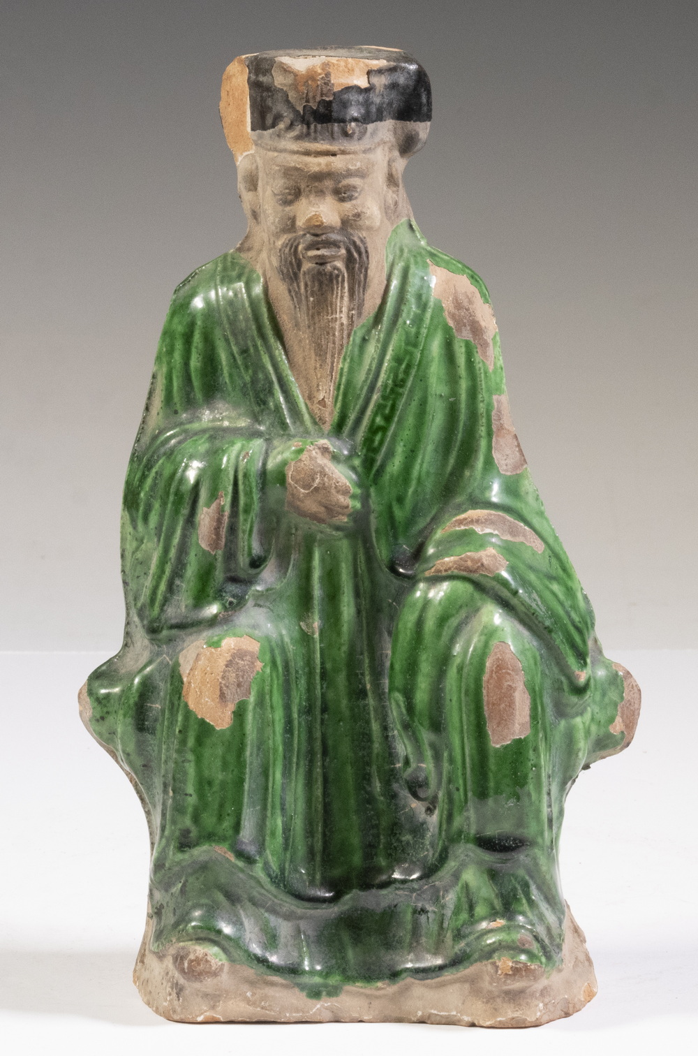 Appraisal: CHINESE KANGXI - SANCAI GLAZED POTTERY FIGURE OF CONFUCIUS Seated