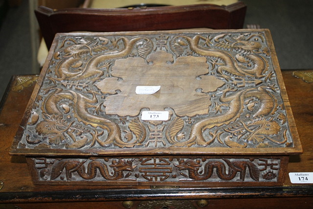 Appraisal: A CHINESE CARVED HARDWOOD ARTIST'S TABLE the top decorated with