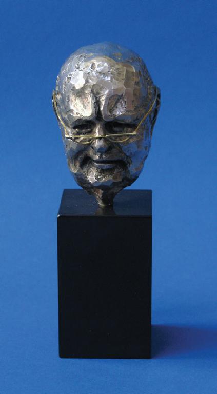 Appraisal: A CAST BUST modelled as Winston Churchill on a hardstone