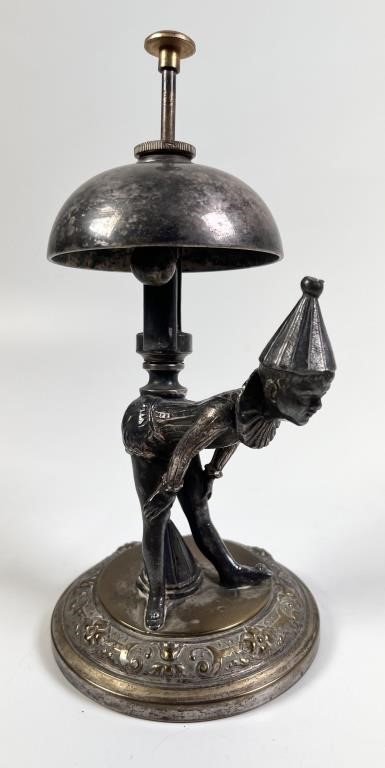 Appraisal: Desk bell with figural boy in jester or clown attire