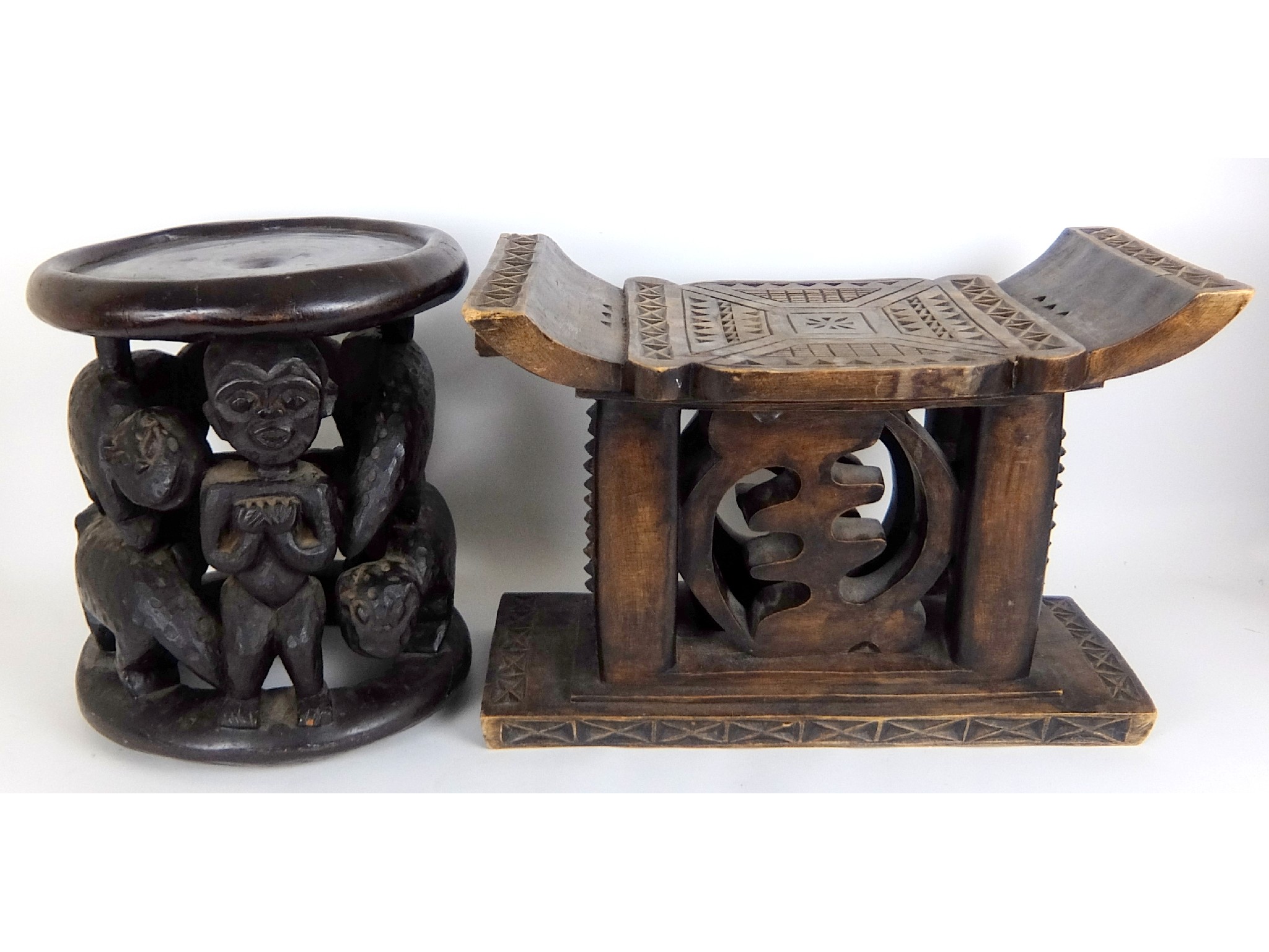 Appraisal: An African Bamileke carved wood stoolwith a central figure and