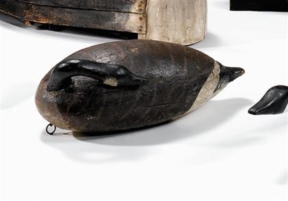 Appraisal: Carved and painted sleeping canada goose decoy early th century