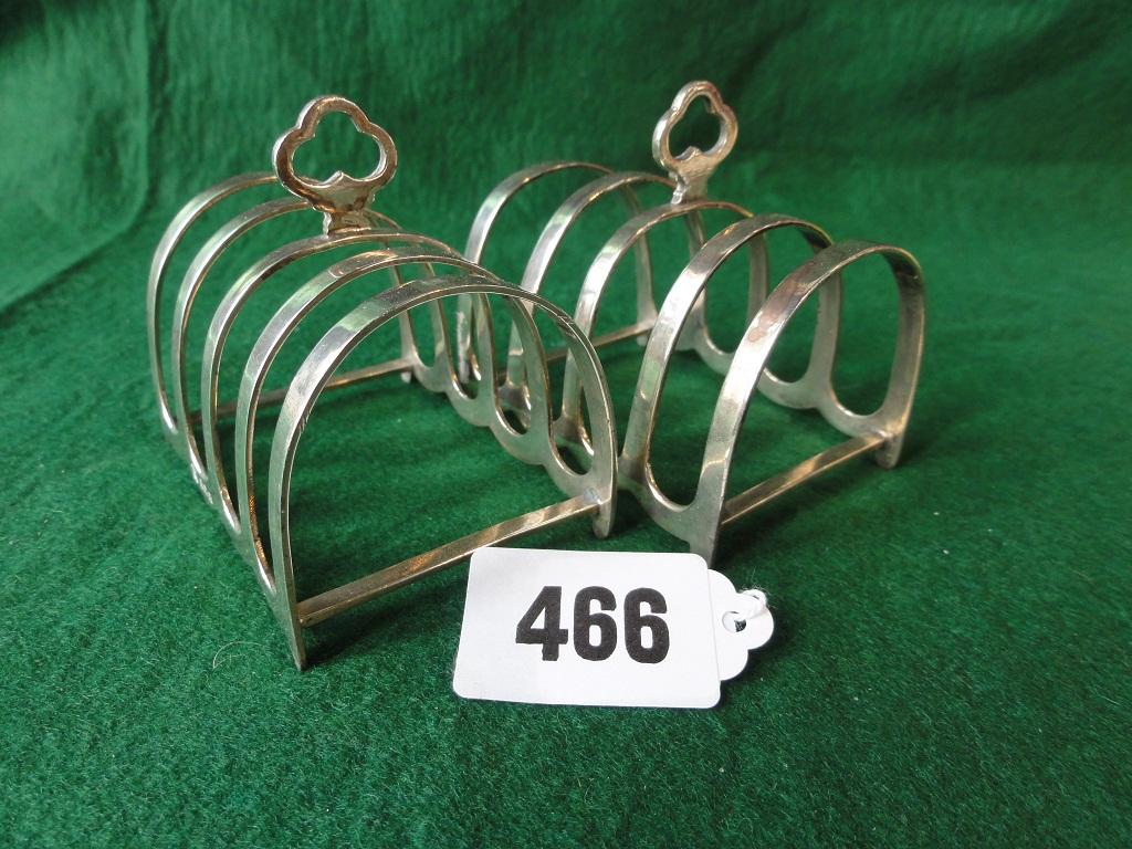 Appraisal: A pair of small silver toast racks with club shaped