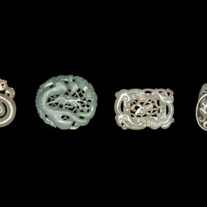 Appraisal: Four Chinese Celadon Jade Pendants each depicting sinuous dragons Length