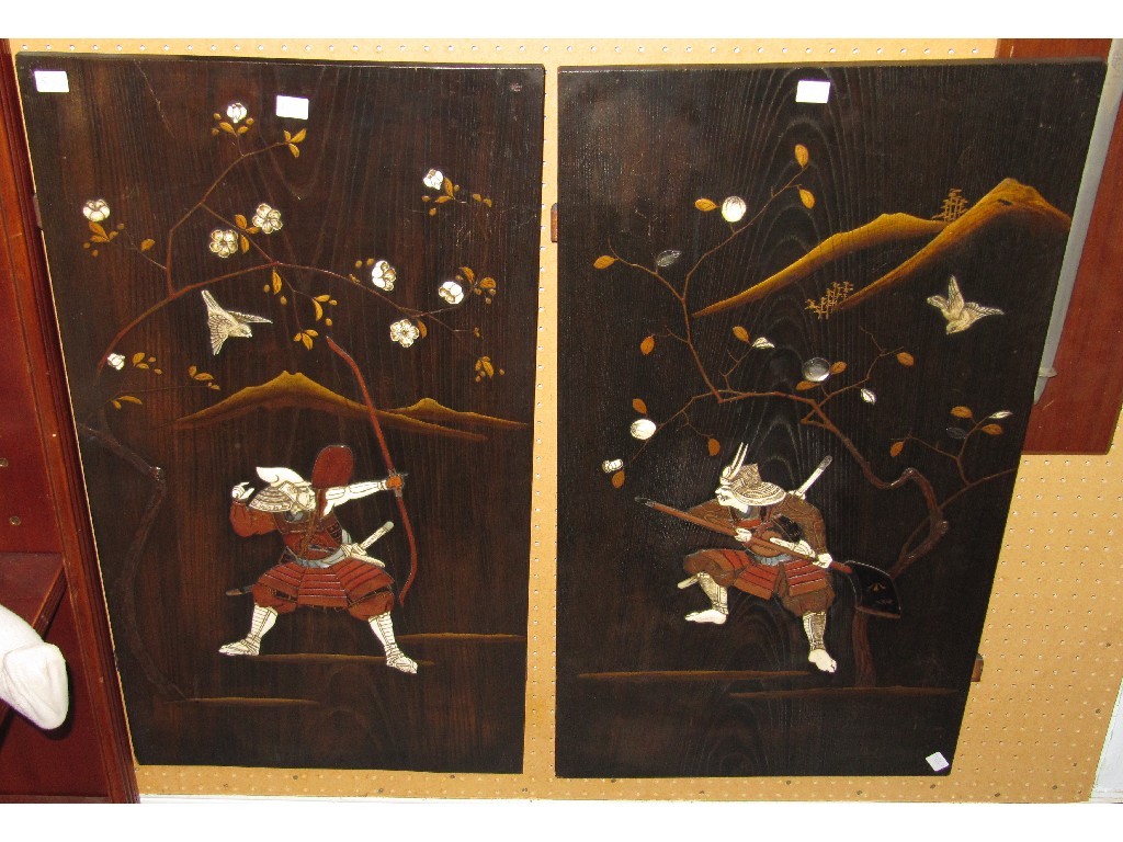 Appraisal: Pair of carved wood and ivory panels depicting Samurai