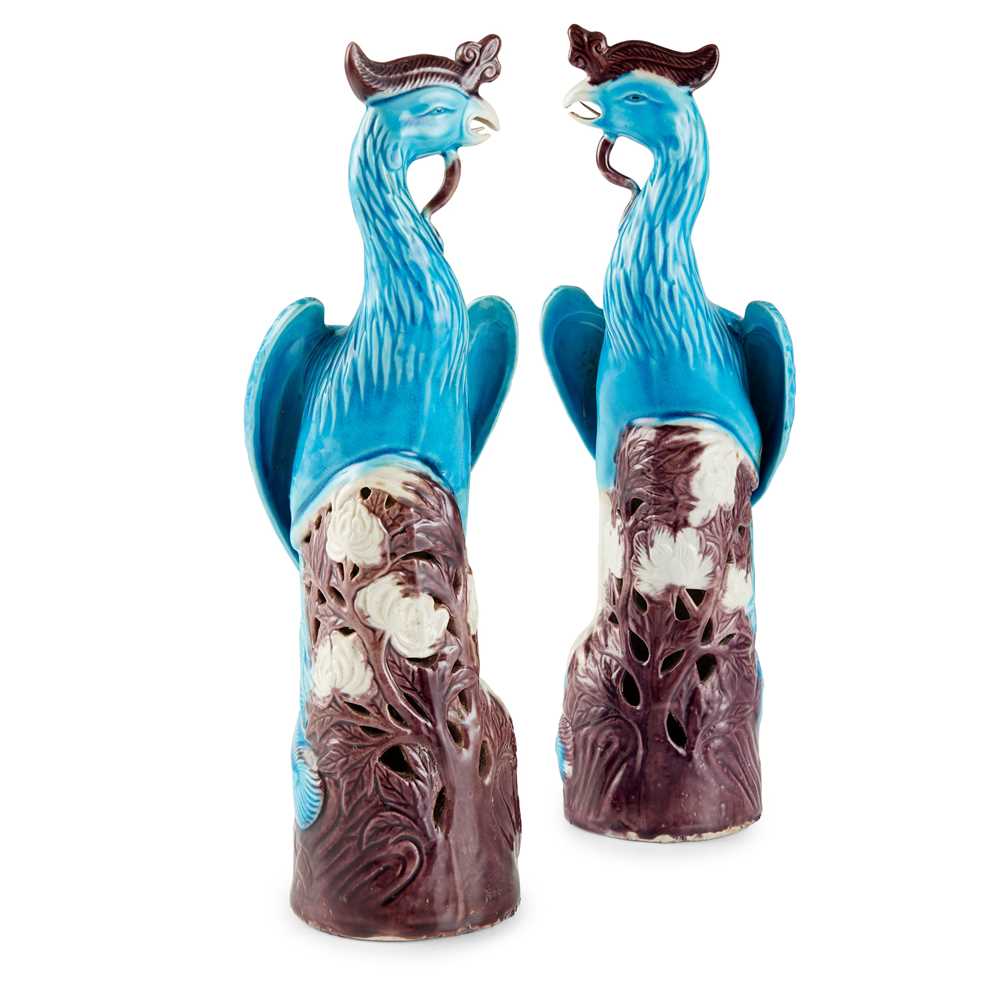 Appraisal: PAIR OF TURQUOISE AND AUBERGINE GLAZED PHOENIXES TH CENTURY each