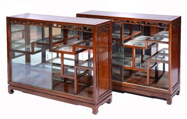 Appraisal: A PAIR OF CHINESE HARDWOOD DISPLAY CABINETS the interior with