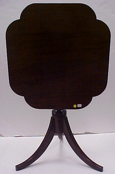 Appraisal: th C mahogany tilt top candlestand shaped top turned standard