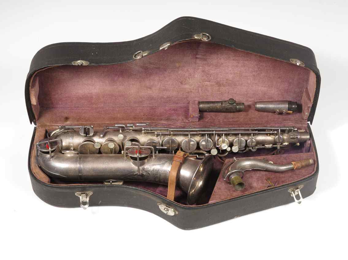 Appraisal: SILVERPLATED BUESCHER TRUE TONE SAXOPHONE Engraved front serial number dates