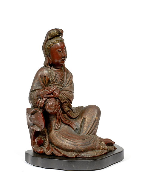 Appraisal: A Chinese dry lacquer model of Guanyin th Centurythe seated