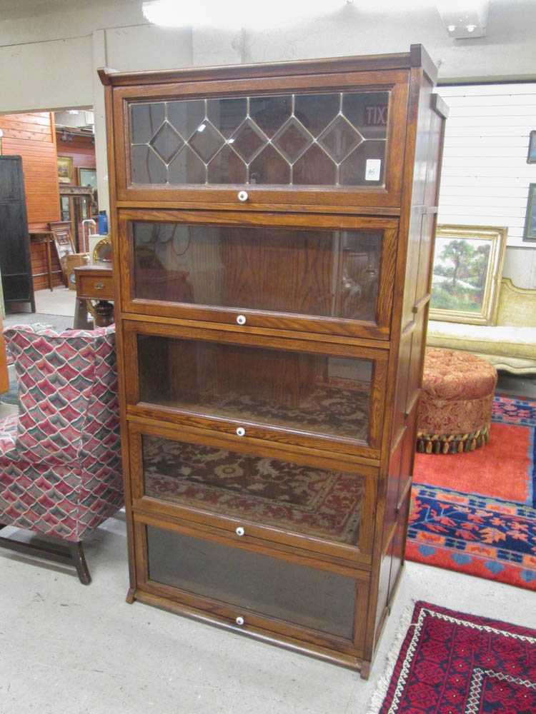 Appraisal: A 'STACKING' OAK BOOKCASE antique reproduction having five horizontal sections