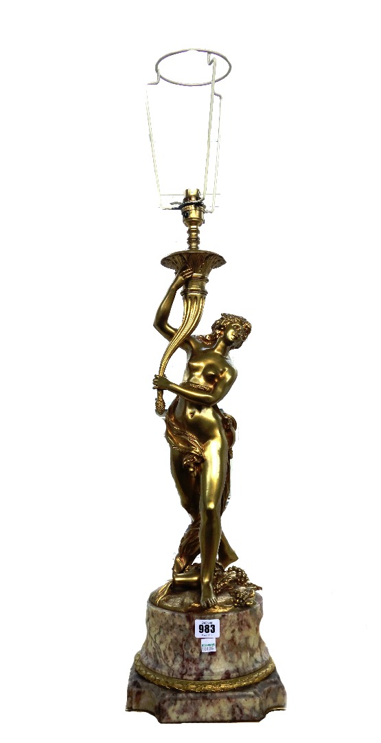 Appraisal: A modern gilt metal and marble figural table lamp modelled