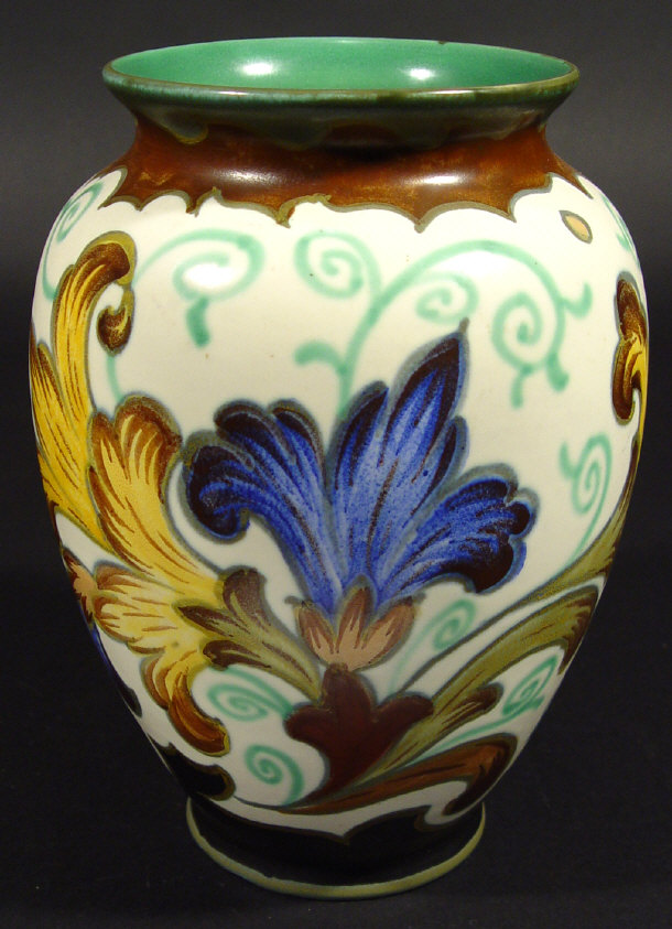 Appraisal: Large Gouda pottery baluster vase hand painted with stylised flowers