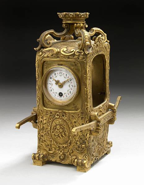 Appraisal: A French gilt bronze timepiece in the form of a