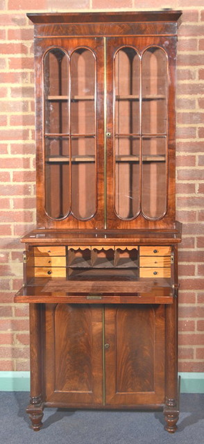 Appraisal: A GEORGE IV SECRETAIRE BOOKCASE OF SMALL PROPORTIONS the interior