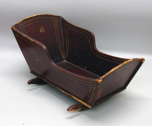 Appraisal: Cradle Wooden rocking doll cradle with original burgundy paint and