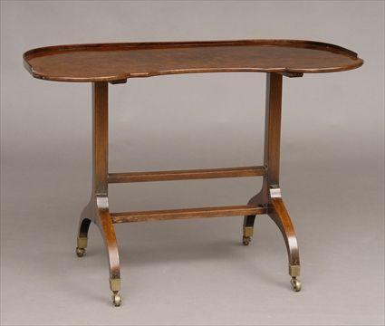 Appraisal: GEORGE III FIGURED MAHOGANY KIDNEY-SHAPE WRITING TABLE With applied low