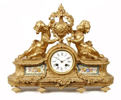 Appraisal: A th century French ormolu and porcelain mounted mantel clock