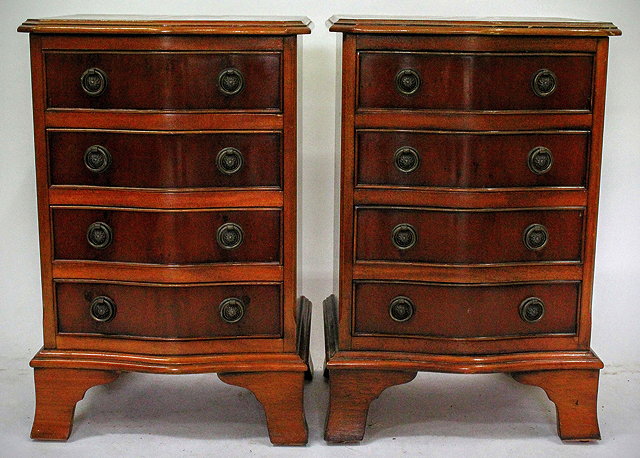 Appraisal: A PAIR OF MODERN YEW WOOD VENEERED SERPENTINE BEDSIDE CHESTS