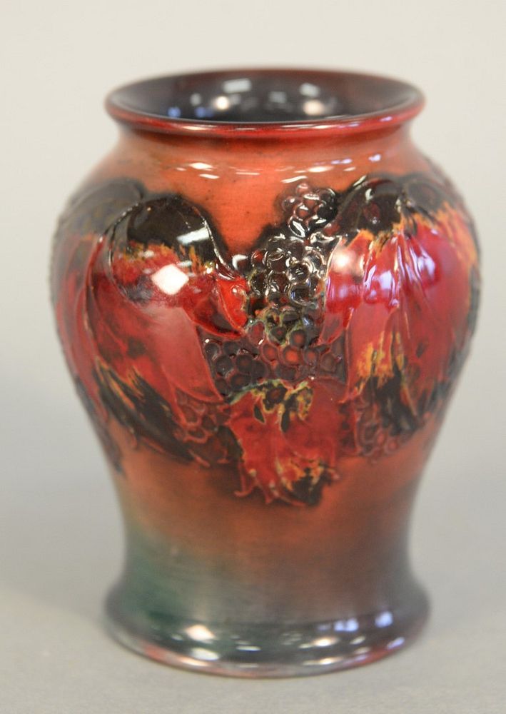 Appraisal: Moorcroft Vase red glazed with leaves and fruit design Pattern