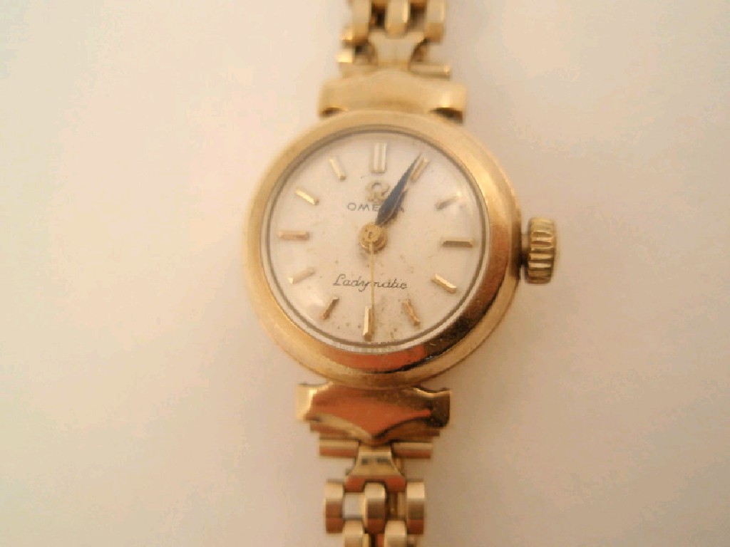 Appraisal: A ct gold ladies Omega Ladymatic bracelet wristwatch