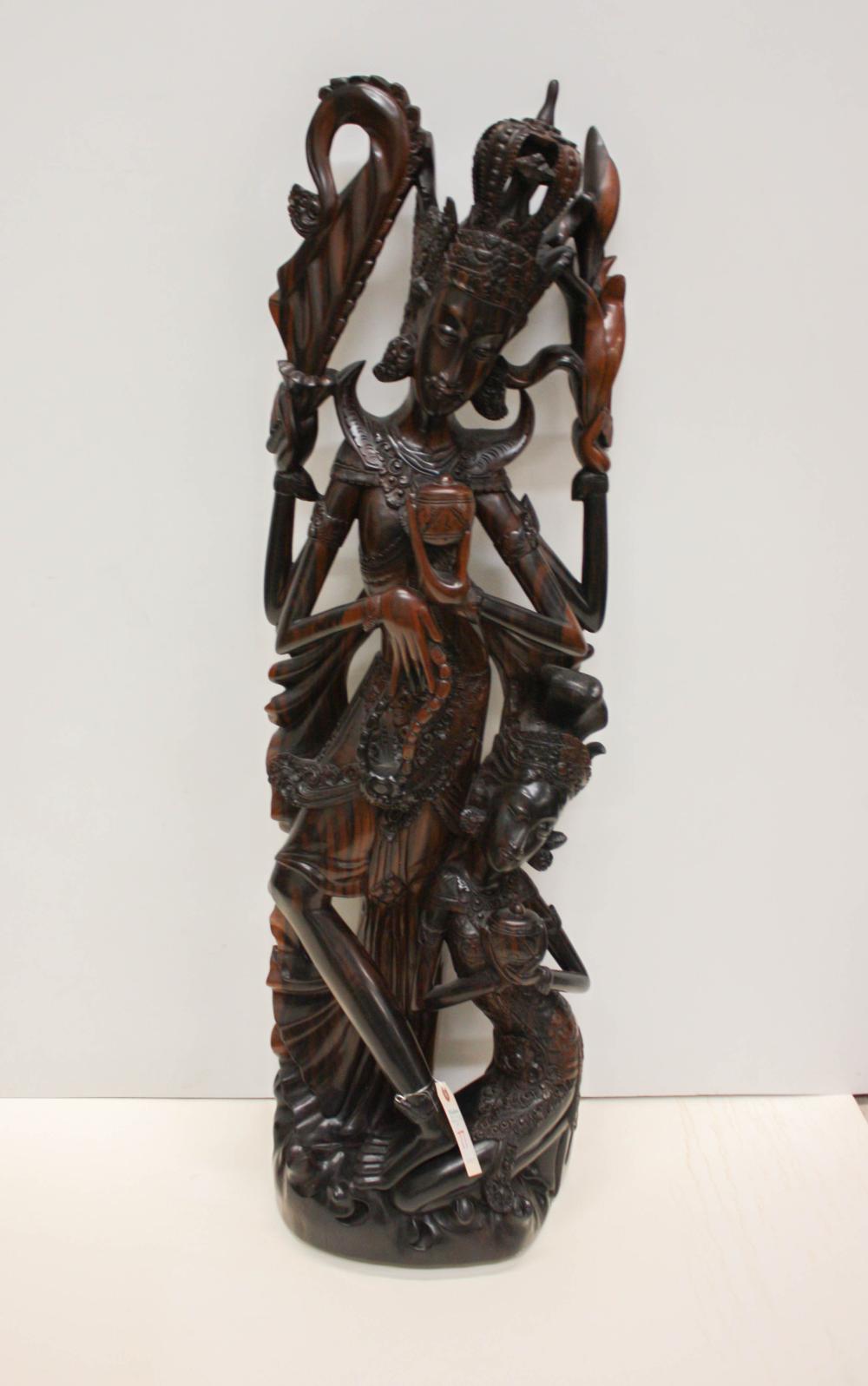 Appraisal: FIGURAL EXOTIC WOOD CARVING male and female deity figures H