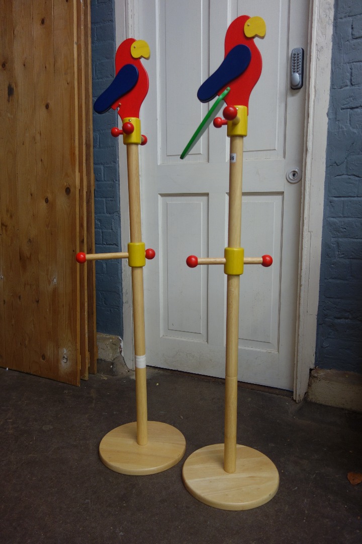 Appraisal: Two children's modern wooden coat stands each surmounted by a