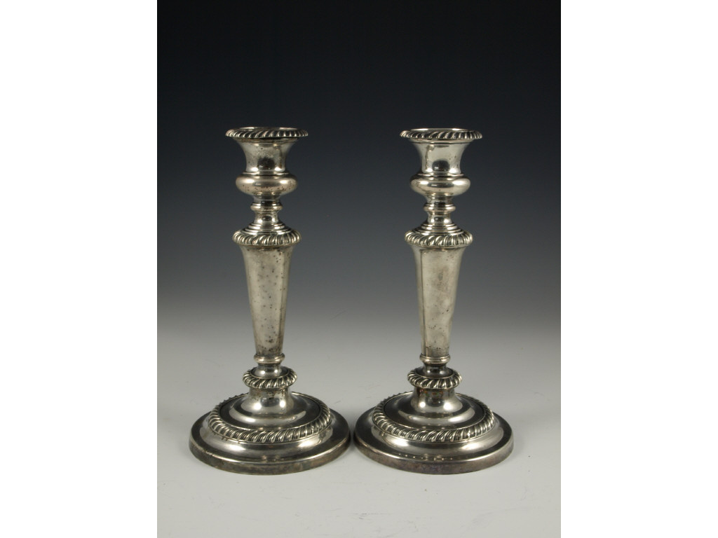 Appraisal: Sheffield Silver Plated Candlesticks th c having urn nozzles w