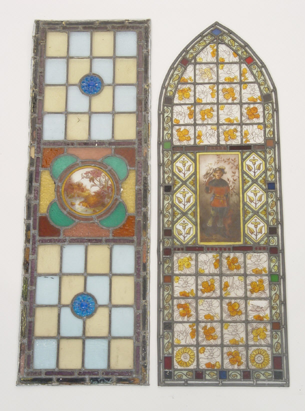 Appraisal: Two stained glass windows with painted decoration one arch shaped