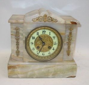 Appraisal: A CARVED ONYX MANTEL CLOCK time and strike with gilt