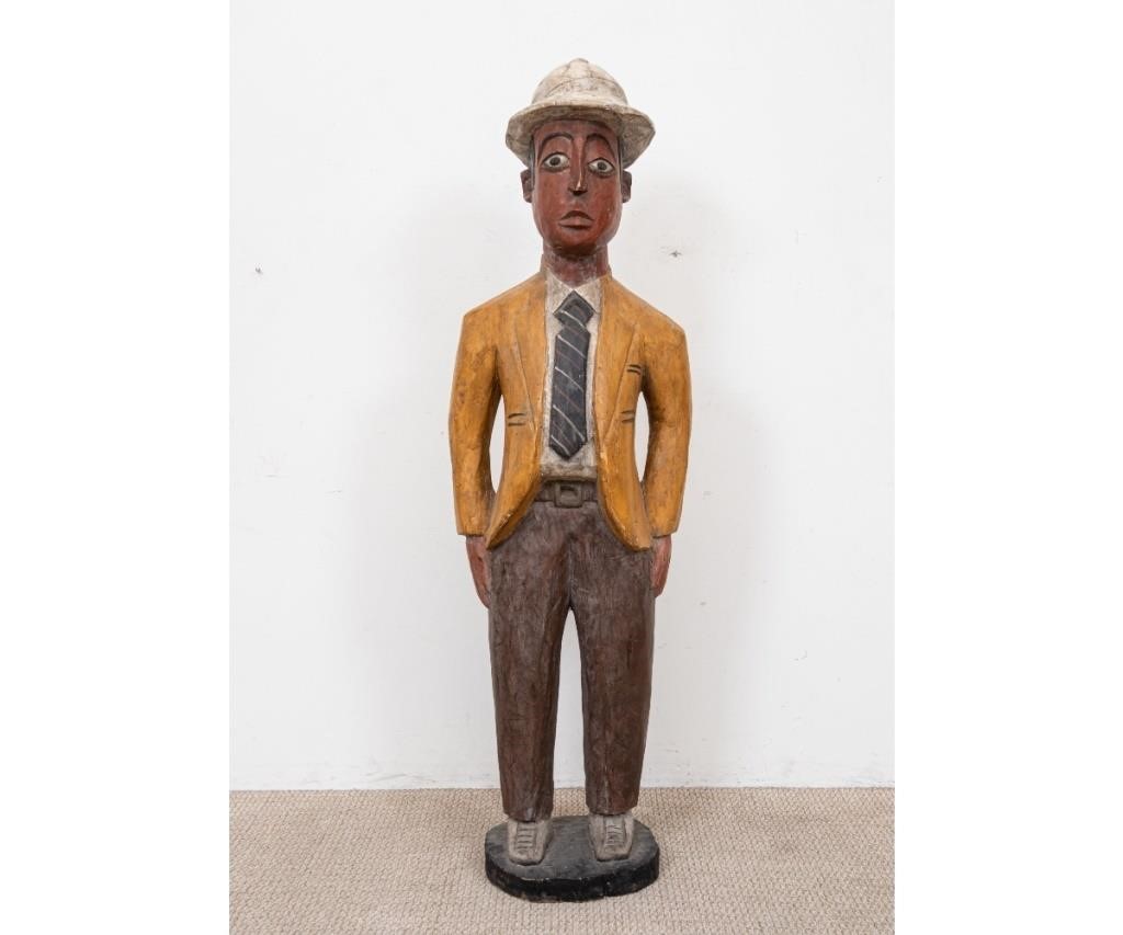 Appraisal: Large wood carved figure of a man with hat and