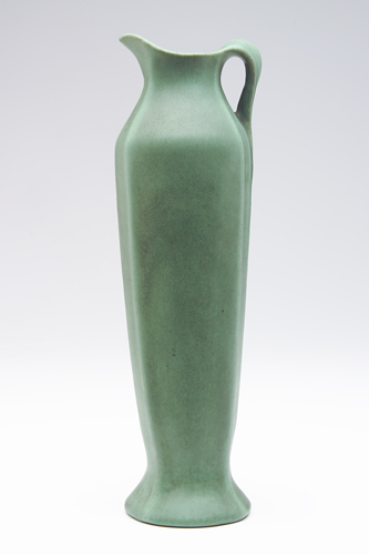 Appraisal: TECO Tall pitcher with twisted handle covered in smooth matte