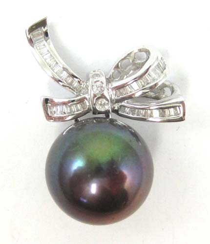 Appraisal: BLACK PEARL AND DIAMOND PENDANT k white gold with a