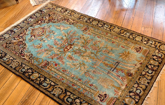 Appraisal: A QUM MEHRAB DESIGN IRANIAN RUG The turquoise ground with