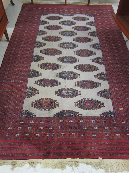 Appraisal: HAND KNOTTED BOKHARA CARPET repeating diagonal rows of geometric latch-hook