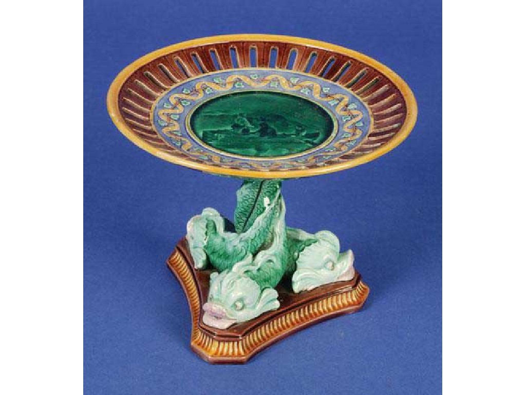 Appraisal: A Wedgwood majolica comport with dolphin column and triform base