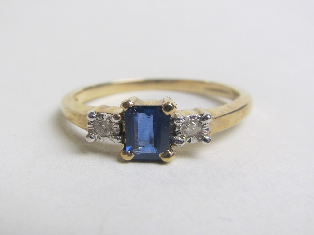 Appraisal: Nine carat gold sapphire and diamond three stone ring