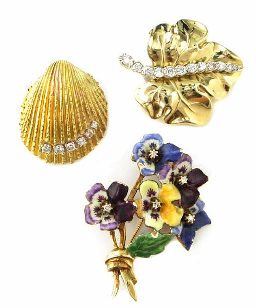 Appraisal: A collection of three brooches featuring a diamond and gold