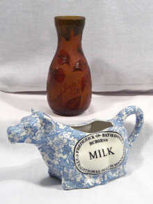 Appraisal: A blue and white ceramic cow creamer cm long printed